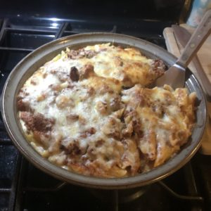 Clay Coyote Savory Pie Dish in action with a pasta, cheese, meat sauce. 