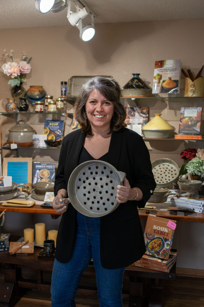 Morgan Baum, CEO & Owner of the Clay Coyote Gallery & Pottery in Hutcinson, Minnesota. Holding a Flameware Grill Basket